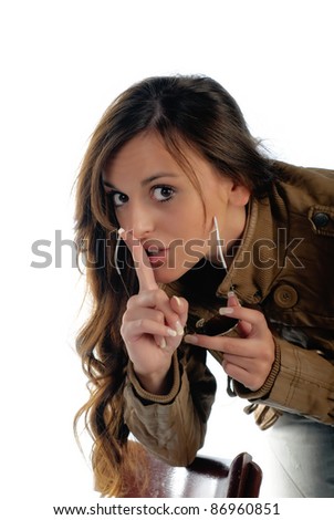 Girl isolated on white expressing Shhh or be quiet