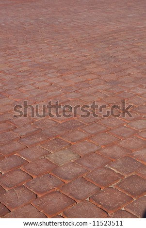 Red paving stones in a parking lot
