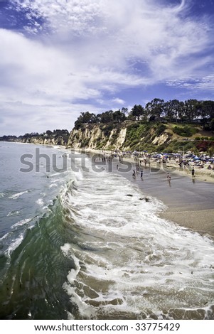 Wave rolls ashore at Paradise Cove in Malibu California