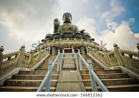 HONG KONG - AUGUST 29: Tian Tan Buddha on Lantau Island in Hong Kong on August 29, 2013. It is 34 meters tall and is a major centre of Buddhism in Hong Kong, it is also a popular tourist attraction