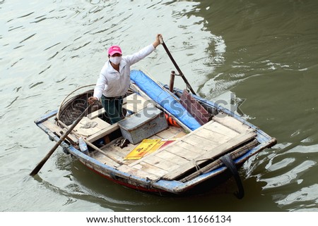 vietnamese woman: boat on the perfume river