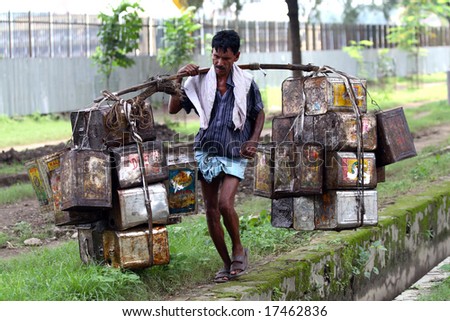 BOMBAY, INDIA - 30 JUNE 2008: The man is working as a porter. One of the most popular ways to earn money by poor people in India.