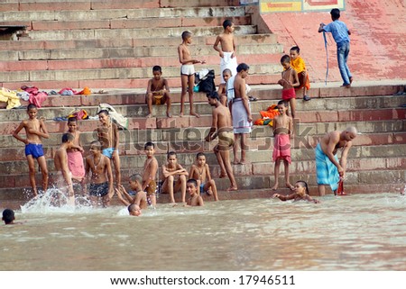 VARANASI, INDIA - 10 JULY: People wade in water during a religious ceremony at Uttar Pradesh on July 10, 2007 in Varanasi, India.