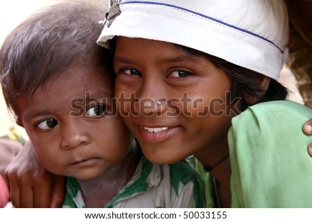 AGRA, INDIA - JUNE 19: Portrait of tribal familly in a village in india, from Agra June 19, 2008 in Agra, India.
