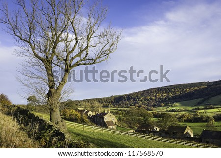 Glaisdale, Yorkshire, UK. A typical farm house in the heart of the North York Moors near the village of Glaisdale and set in the beautiful undulating moorland landscape and the colours of autumn.