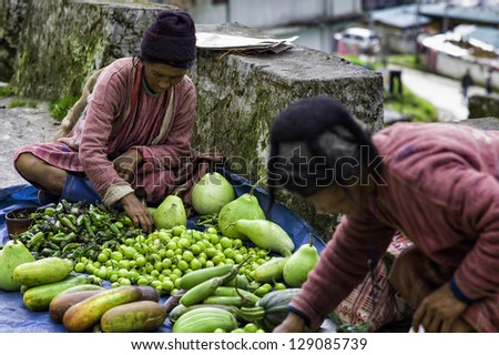 TAWANG, INDIA - SEPTEMBER 20: unidentified vendors from the Monpa tribe sell home grown vegetables on the street on September 20, 2012 at Tawang, western Arunachal Pradesh, India.