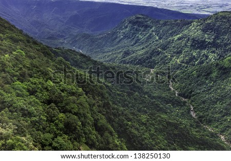 Cherrapunjee, Meghalaya, India. View of the Khasi Hill with thick forests, deep valley gorges, and a river near the town of Cherrapunjee, the wettest place on earth, in Meghalaya, north east India.
