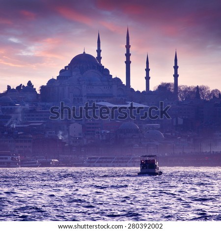 A boat trip on the Bosphorus at sunset. Istanbul at sunset. Evening Istanbul. Tourist trip in Turkey.