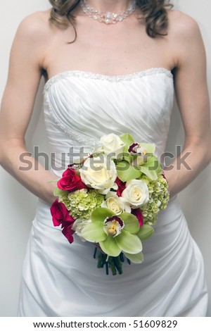 bride is holding wedding flower bouquet