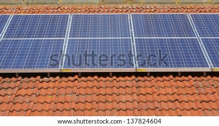 Solar panels on a tile roof.