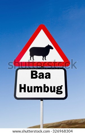 Red and white triangular road sign with an Baa Humbug play on words concept against a partly cloudy sky background