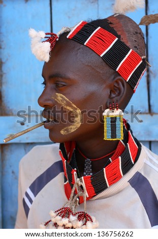 SOUTH OMO - ETHIOPIA - JANUARY 10, 2009: An unidentified Hamer warrior on January 10, 2009 in South Omo, Ethiopia. A 5-year resettlement program started 2011 threatens the tribes in Ethiopia