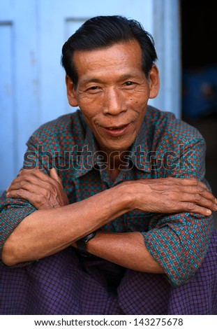 MANDALAY - MYANMAR - DECEMBER 9, 2012: An unidentified Burmese man on December 9, 2012 in Mandalay, Myanmar. In 2012 an ongoing conflict started between Buddhists and Muslims in Myanmar.