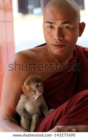 SAGAING - MYANMAR - DECEMBER 13, 2012: An unidentified Burmese Buddhist monk on December 13, 2012 in Sagaing, Myanmar. In 2012 an ongoing conflict started between Buddhists and Muslims in Myanmar.