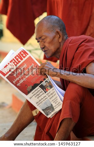 MANDALAY - MYANMAR - DECEMBER 11: An unidentified Burmese Buddhist monk on December 11, 2012 in Mandalay, Myanmar. In 2012 an ongoing conflict started between Buddhists and Muslims in Myanmar.