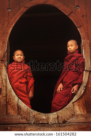 NYAUNGSHWE - MYANMAR - DECEMBER 25, 2012: Unidentified Burmese Buddhist monks on December 25, 2012 in Nyaungshwe, Myanmar. In 2012 an ongoing conflict started between Buddhists and Muslims in Myanmar