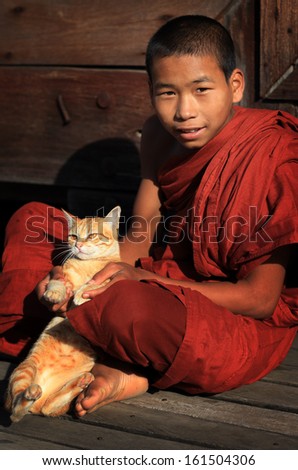 NYAUNGSHWE - MYANMAR - DECEMBER 18, 2012: Unidentified Burmese Buddhist monk on December 18, 2012 in Nyaungshwe, Myanmar. In 2012 an ongoing conflict started between Buddhists and Muslims in Myanmar