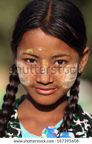 MANDALAY - MYANMAR - DECEMBER 15, 2013: An unidentified girl on December 15, 2013 in Mandalay, Myanmar. In 2012 an ongoing conflict started between Buddhists and Muslims in Myanmar.