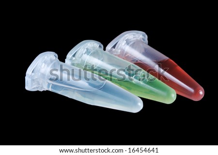 Eppendorf vials with white, red and green liquid isolated on black background