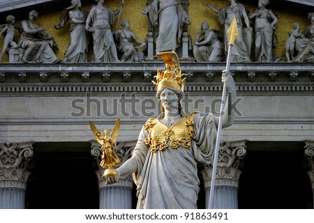 Statue of the greek goddess Pallas Athena with spear and Nike. The sculpture is on the front side of the Austrian parliament building