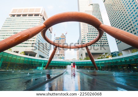 SINGAPORE - MARCH 10, 2014: The Fountain of Wealth. Fountain of Wealth appears like a golden ring in the palm of the hand and was designed by Tsao & McKown Architects with emphasis on feng shui.