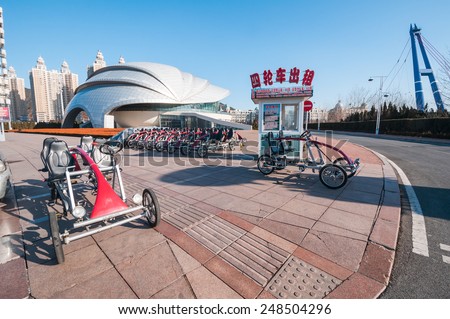 Dalian, China - January 19, 2015 : Four wheels bikes for rent at Xinghai square. The Square covers total area of 1.1 million square metre, making it the largest city square in the world.