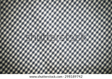 Blue checked clothes fabric texture background.