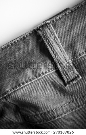 Black denim jeans on white background