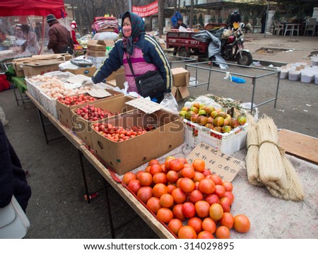 Dalian, China - January 18, 2015 : Street fruit seller on street market in China.