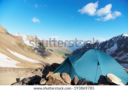 tent in the mountains. alpine camp. summer hiking