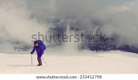 hiker in the mountain. Climb to the top. mountaineering. vintage stylization