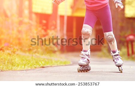 child rollerblading outdoors. sport lifestyle. roller skating