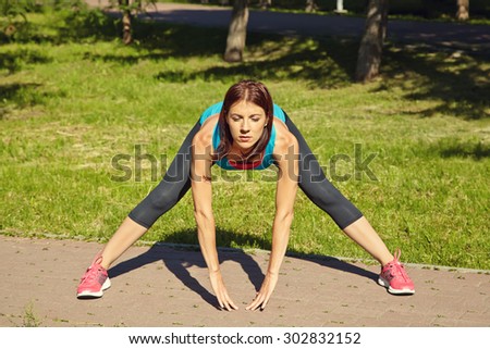 sporty athletic woman on a grass background. outdoor sports. healthy sport lifestyle. fitness, yoga, exercises