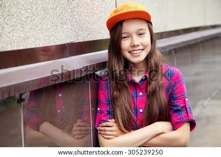Beautiful teenage girl outdoors. youth lifestyle. portrait of adolescent in the city
