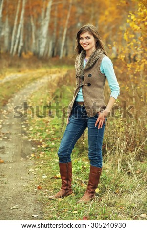 outdoor portrait of a beautiful brunette middle aged woman