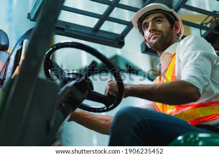engineer staff male warehouse worker in hard hat working. walking through logistics center warehouse factory construction site logistics architect forklife driver man builder indoors background