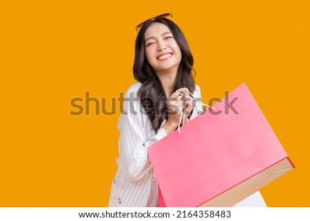 Similar – Image, Stock Photo Studio shot of pretty slim woman keeps hand in pocket, wears casual t shirt and jeans, stands in relaxed pose, looks at camera self confident, isolated over beige background talks casually with client