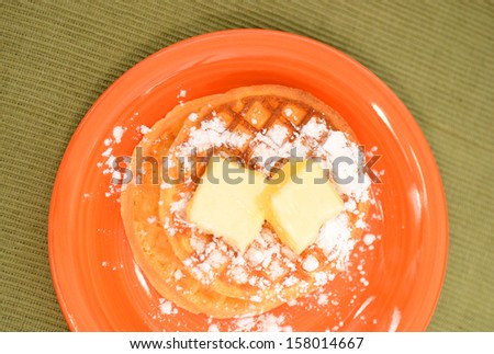 two waffles and powdered sugar for comfort food