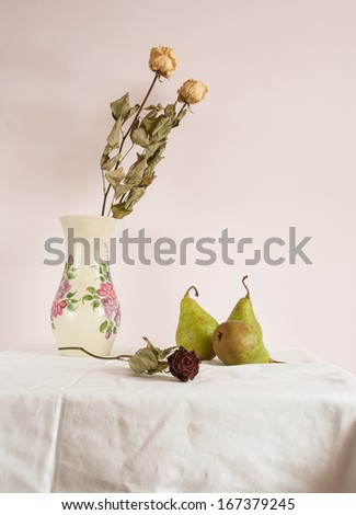still life with withered roses in jug and pears