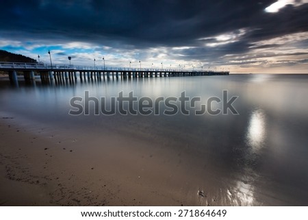 Beautiful long exposure seascape with wooden pier. Pier in Orlowo, Gdynia in Poland.