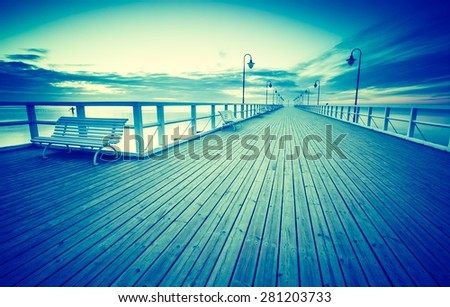 Vintage photo of beautiful long exposure seascape with wooden pier. Pier in Orlowo, Gdynia in Poland.