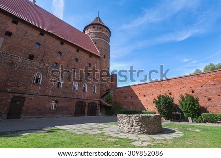 OLSZTYN, POLAND - AUGUST 21, 2015: Old teutonic castle in Olsztyn (Gothic Crusaders castle), tourist attraction of eastern Poland