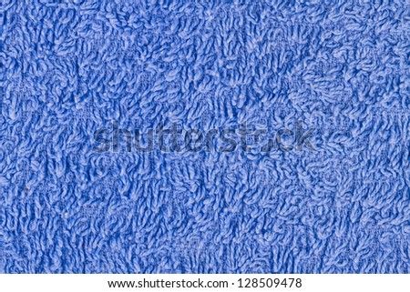 Detail of a light blue terry gross substances in soft lighting