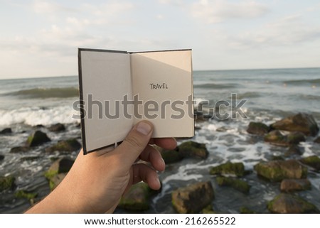 Travel - Inscription on the Book. Travel Concept. Ocean background.