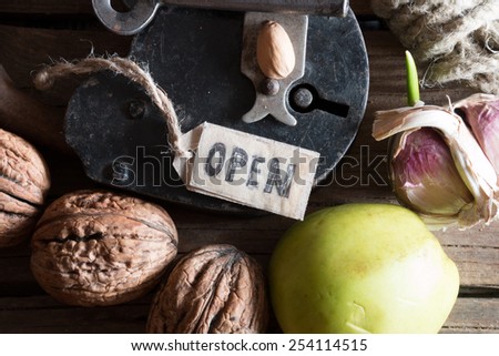open concept, old padlock and key on wooden plank, grocery store