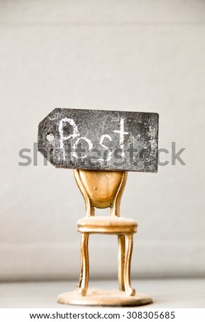 vacant post, golden chair, and an inscription in chalk \