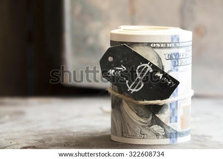 One roll from dollars and a tag with a dollar sign