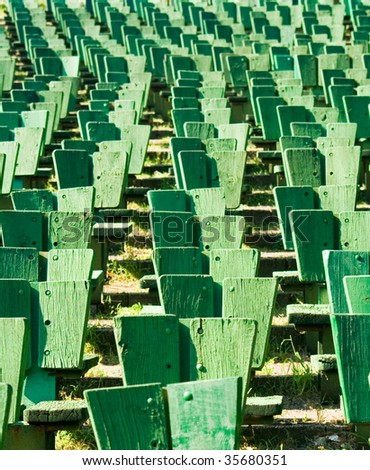 green chairs in an outdoor theater