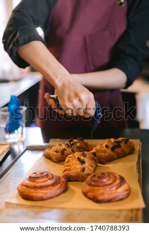 Similar – Foto Bild Erntebäcker, der Teig auf einem Blech auspresst