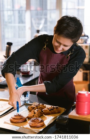 Similar – Foto Bild Erntebäcker, der Teig auf einem Blech auspresst